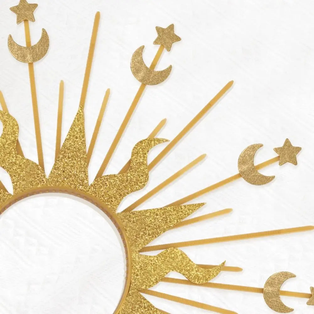 A gold celestial halo headband featuring sun rays and crescent moon and star accents.