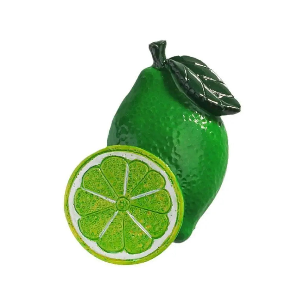 A vibrant green pear with a sliced cross-section displayed on a white background.