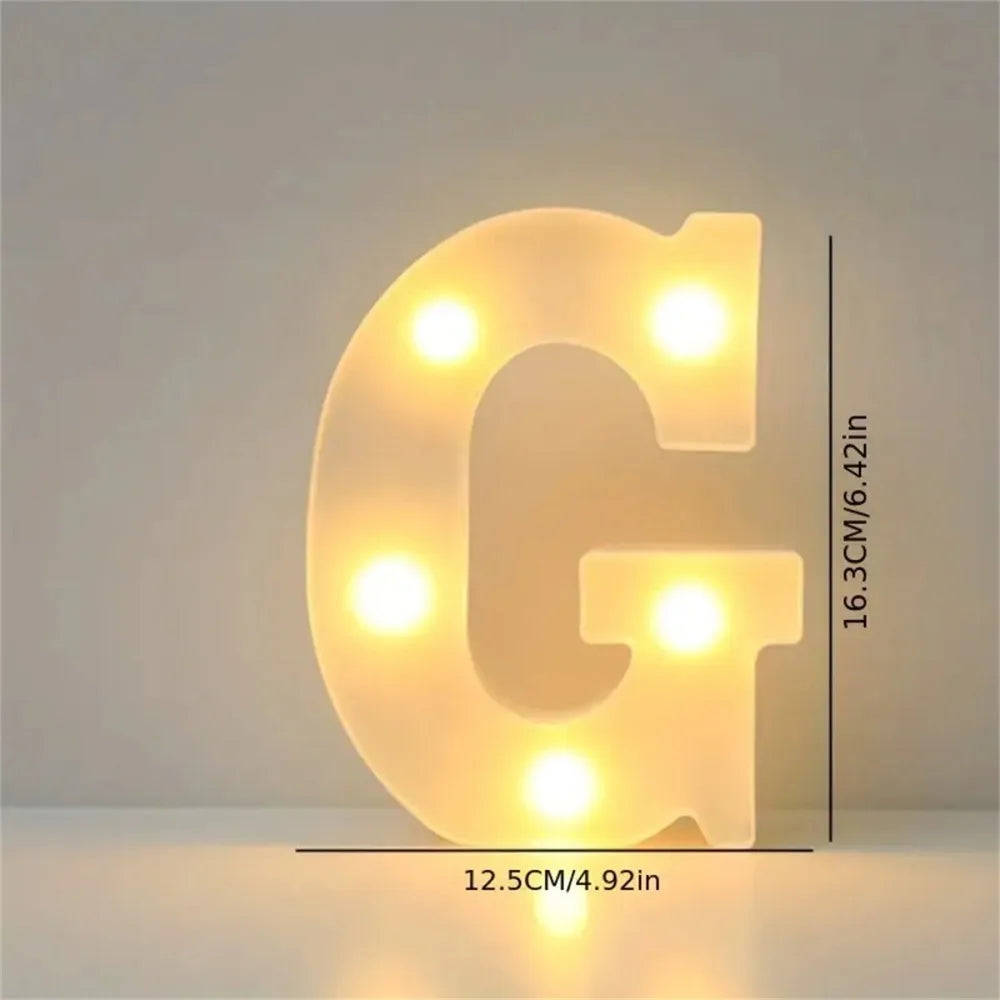 A glowing yellow LED letter light shaped like the letter G, used for room or party decor.