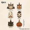 A set of six vintage wooden Halloween hanging ornaments featuring a vampire bat, witch owl, ghost, skeleton, black cat, and p