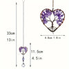 A hanging crystal tree of life sun catcher featuring purple crystals and branches.