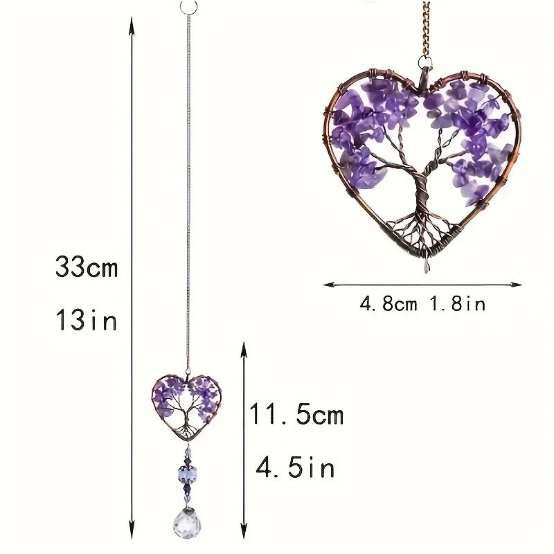 A hanging crystal tree of life sun catcher featuring purple crystals and branches.