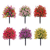 A set of four artificial trees featuring vibrant red, pink, and yellow flowers for home decor