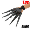 A hand wearing black articulated skeleton gloves with fingers extended, shown on a wrist.