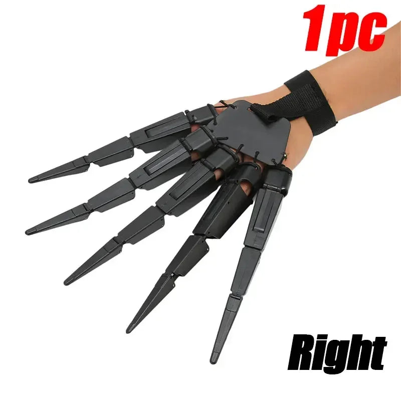 A hand wearing black articulated skeleton gloves with fingers extended, shown on a wrist.