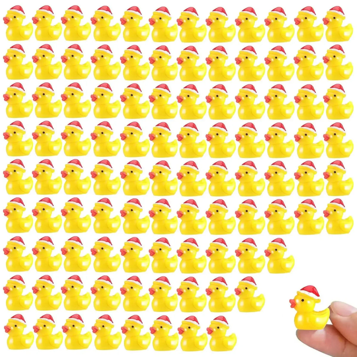 A set of glow-in-the-dark Christmas duck figurines wearing Santa hats.