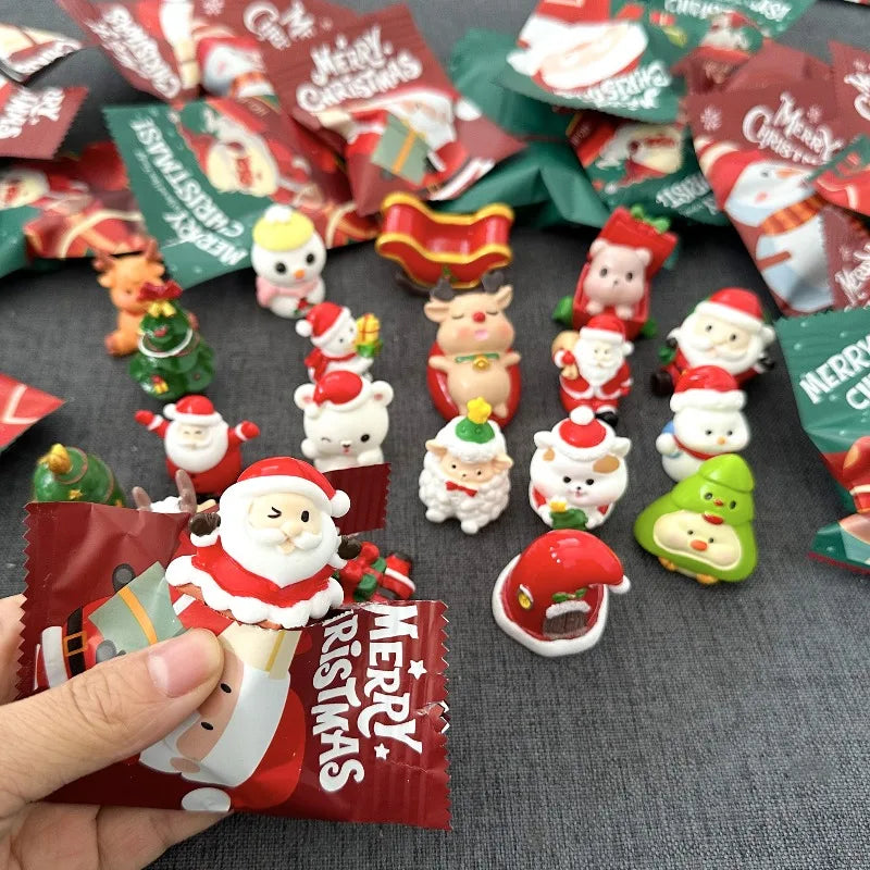 A collection of festive Santa Claus and snowman figurines for Christmas decor arranged on a dark surface.
