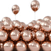 A close-up view of a large pack of chrome metallic balloons in various shades of rose gold and copper.