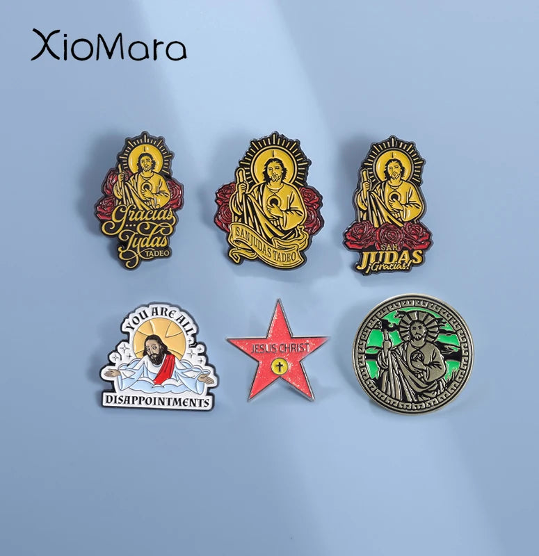 A set of enamel pins featuring religious iconography, including San Judas Tadeo and Jesus Christ.
