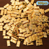 A pile of small, rectangular simulated gold bars used for decor.