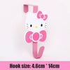 A pink and white cat-shaped over-the-door hook for hanging storage.