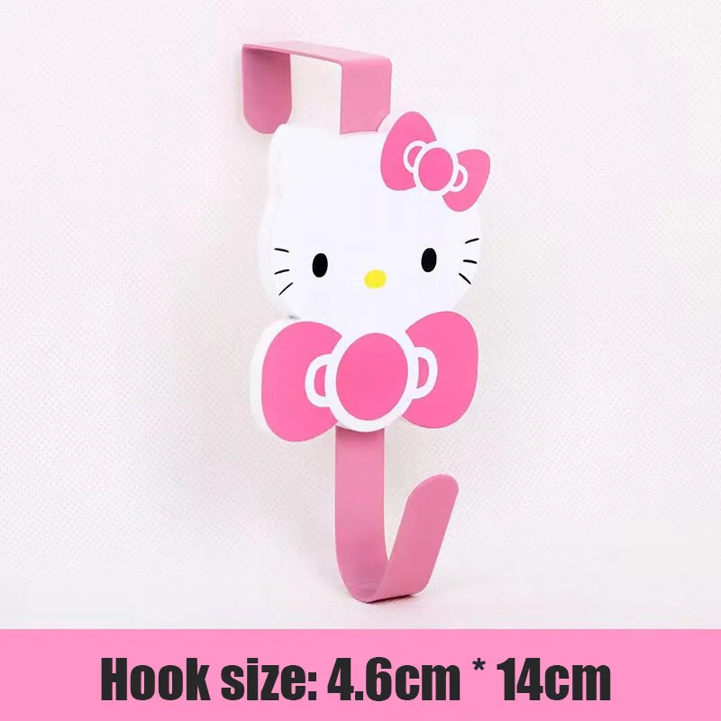 A pink and white cat-shaped over-the-door hook for hanging storage.