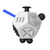 A white hexagonal fidget cube with a black top and blue stick, designed as a stress relief toy.