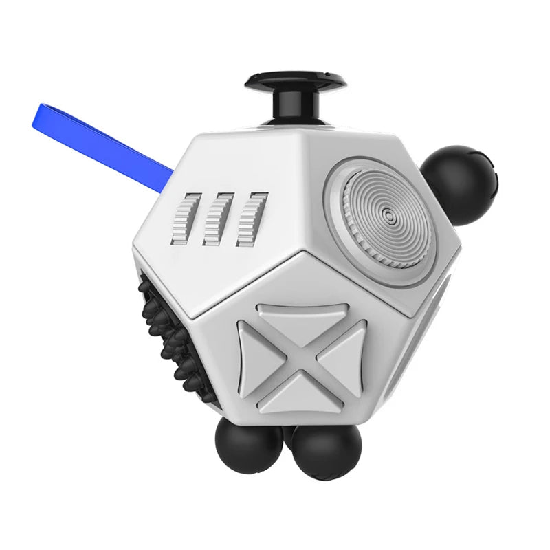 A white hexagonal fidget cube with a black top and blue stick, designed as a stress relief toy.