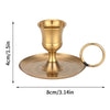 Elegant brass metal candle holder with a flared base and a circular handle for dining or decor