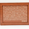A wooden money saving box with a grid tracker showing various amounts of currency.