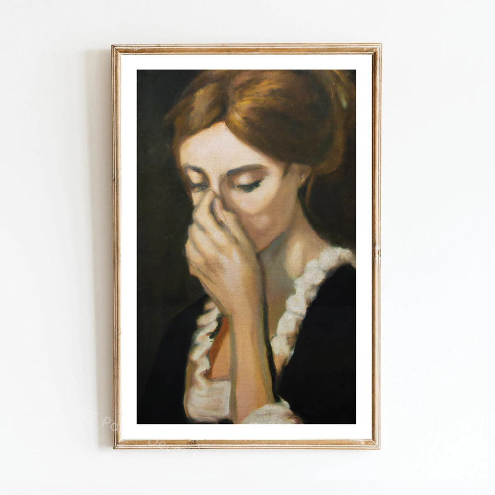 A portrait painting of a woman with reddish hair covering her face, framed in gold.