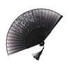 A black vintage bamboo folding fan with a translucent fabric featuring small white and gray floral patterns.