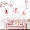 Pink sofa decorated with butterfly and fairy wall decals featuring pink floral branches