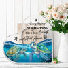 Acrylic tabletop decor featuring a blue sea turtle illustration with text encouraging a new beginning.