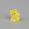 A yellow resin keychain shaped like a cute cat with pink accents.
