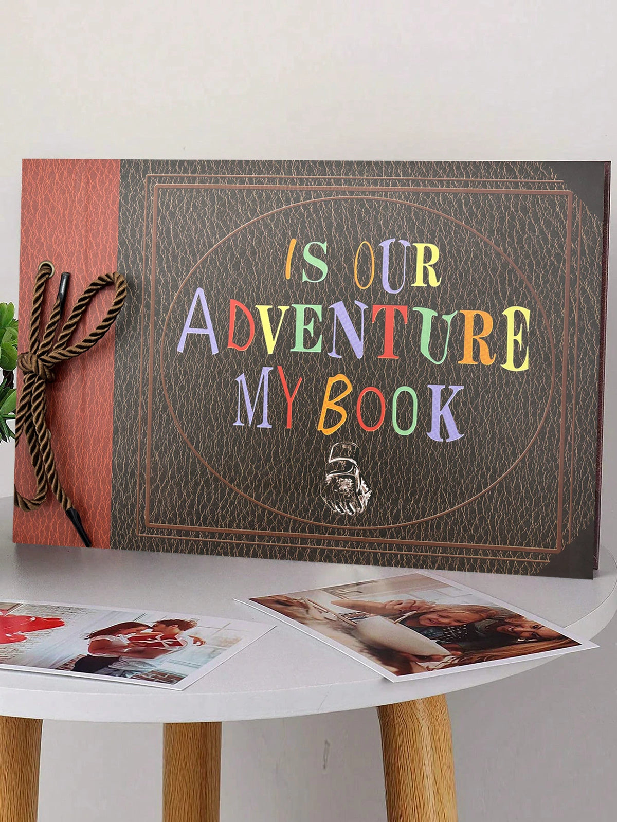 A handmade scrapbook album cover featuring the text Is Our Adventure My Book on a dark background with a textured border.