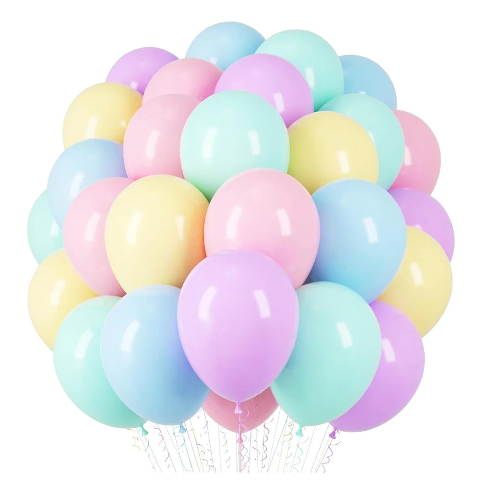 A bunch of pastel rainbow latex balloons in shades of pink, yellow, and blue.