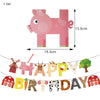 A pink pigshaped backdrop decoration for a birthday party kit featuring various farm animal cutouts and decor.