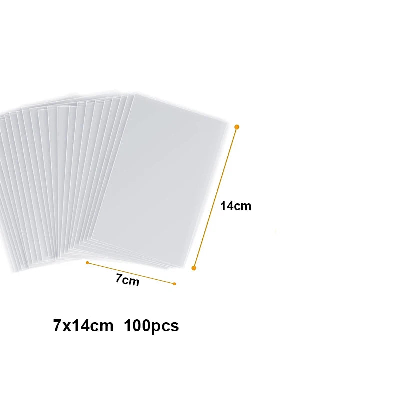 A stack of 100 clear cellophane treat bags with wire ties, showing the size of 7cm by 14cm.