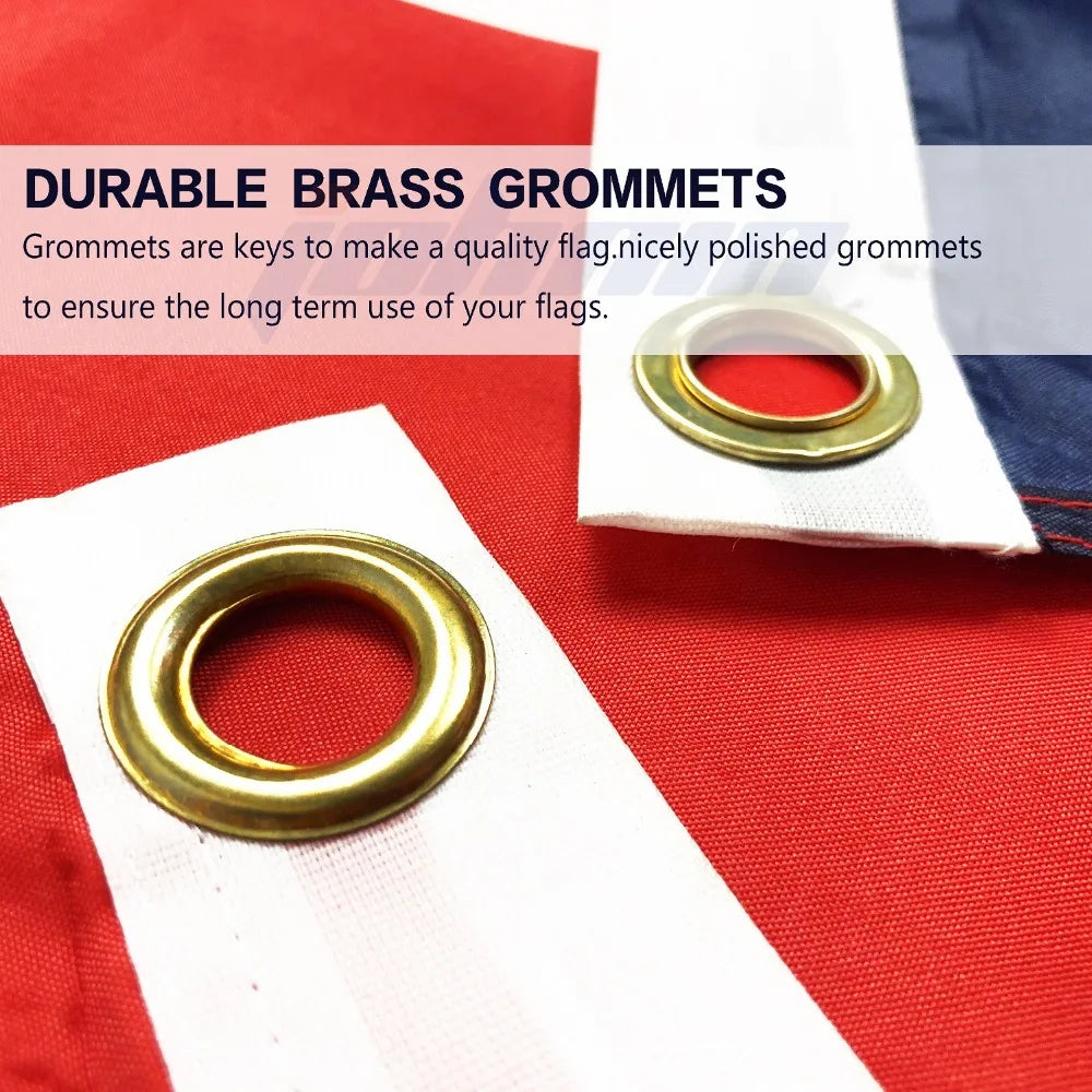 Grommet en laiton utilisé pour fixer un drapeau sur une bannière de tissu rouge.
