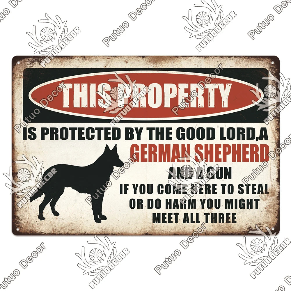 A vintage metal sign with text warning that the property is protected by a German Shepherd and gun.