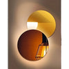 Modern geometric canvas wall art featuring a layered, circular light fixture with warm golden and amber tones.