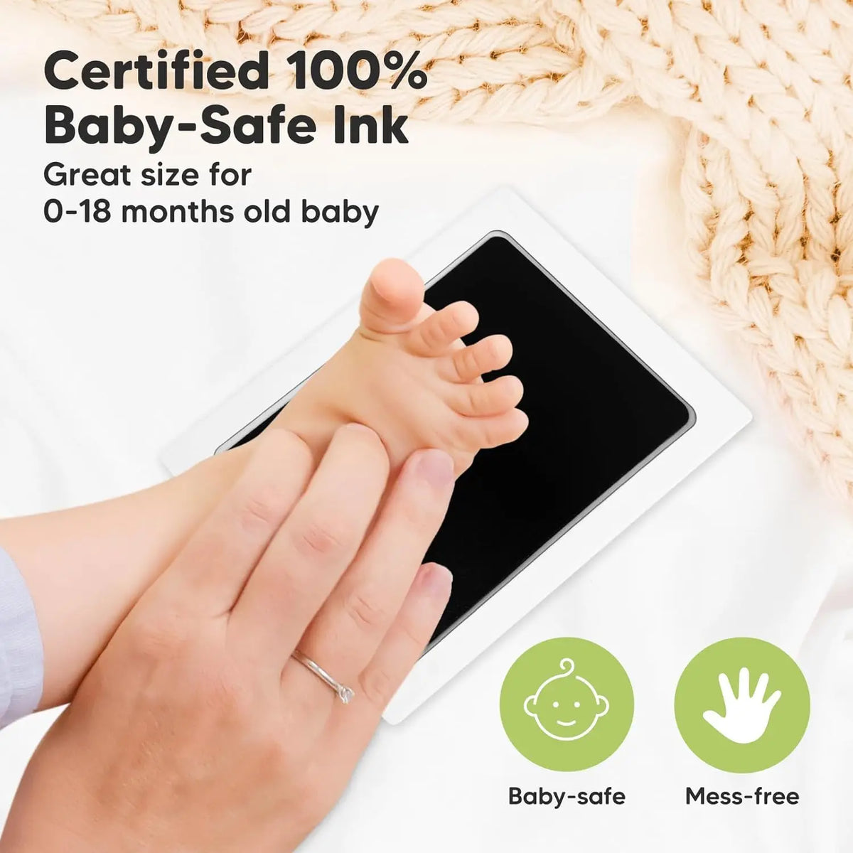 A baby's hand prints on a tablet screen demonstrating a certified 100% baby-safe ink product.
