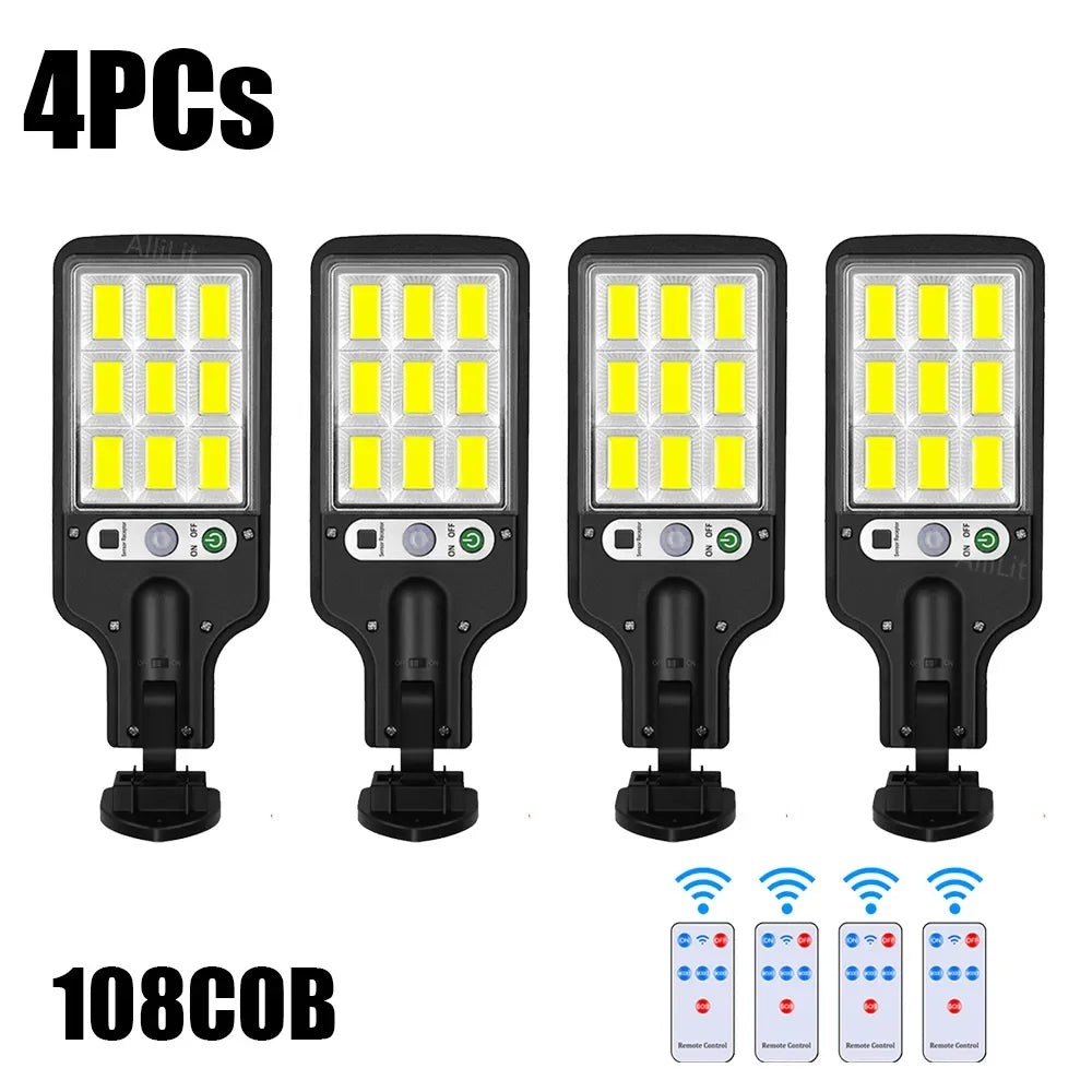 Four solar powered motion sensor security lights with 108 LED bulbs displayed on a white background.