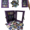 A purple decorative book display featuring multiple small books in glass-fronted wooden frames.