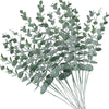A sprig of artificial eucalyptus leaves with slender stems and oval green foliage.