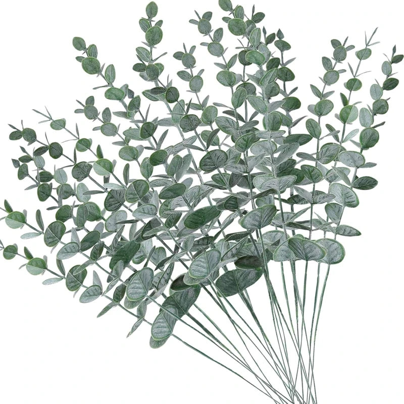 A sprig of artificial eucalyptus leaves with slender stems and oval green foliage.