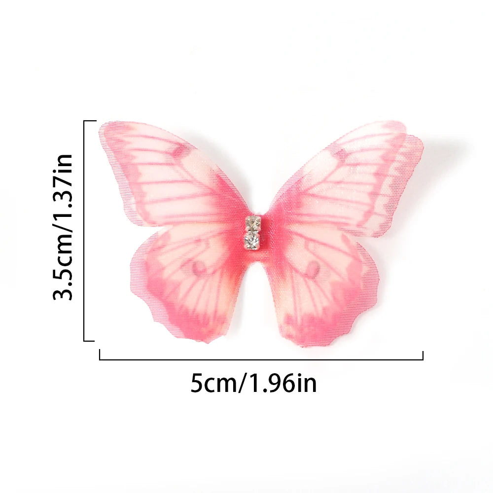 Pink butterfly patch with embroidered details shown against a white background.