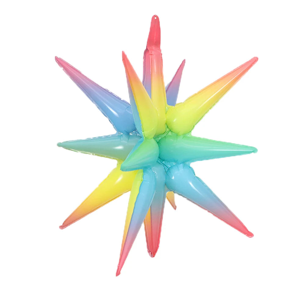 A star burst foil balloon featuring a gradient of pink, purple, blue, and yellow colors.