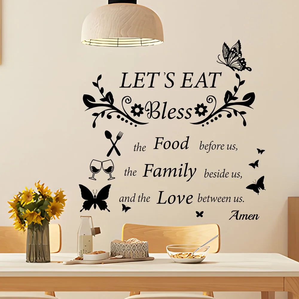 Black silhouette wall decal featuring the text Let's Eat Bless the Food the Family beside us and the Love between us with flo