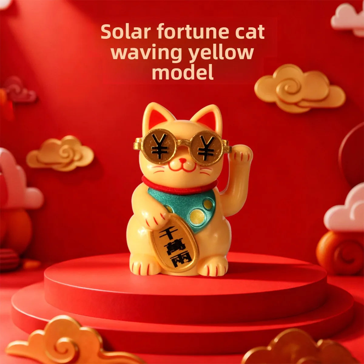 A yellow cat ornament with gold accents and a blue collar is displayed on a red circular base.