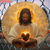 A painting of Jesus with a radiant halo and a glowing sacred heart, set against a wire mesh background.