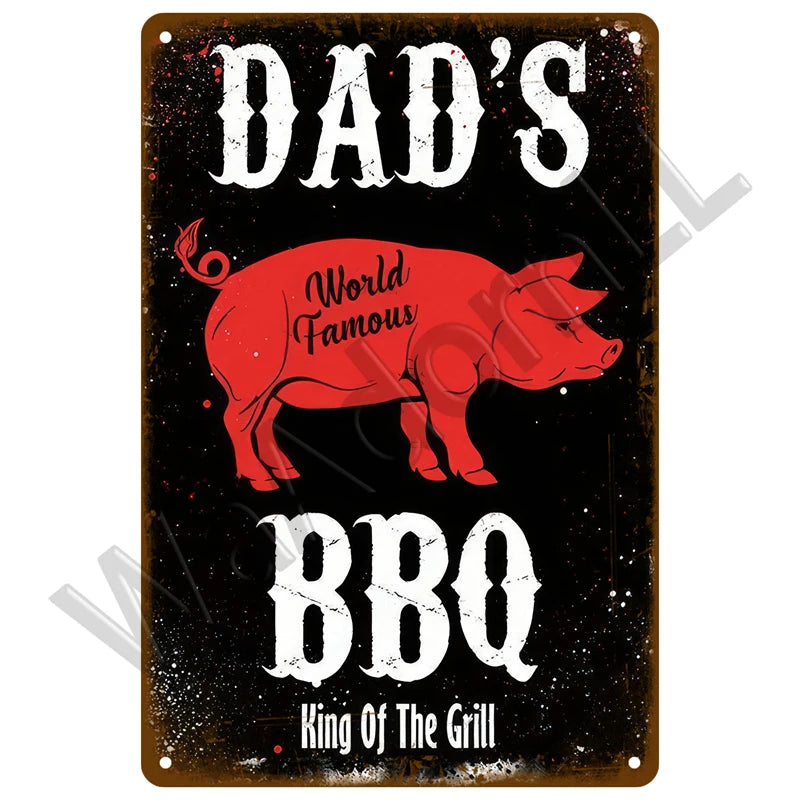 A dark metal sign with white text reading Dad's World Famous BBQ King Of The Grill