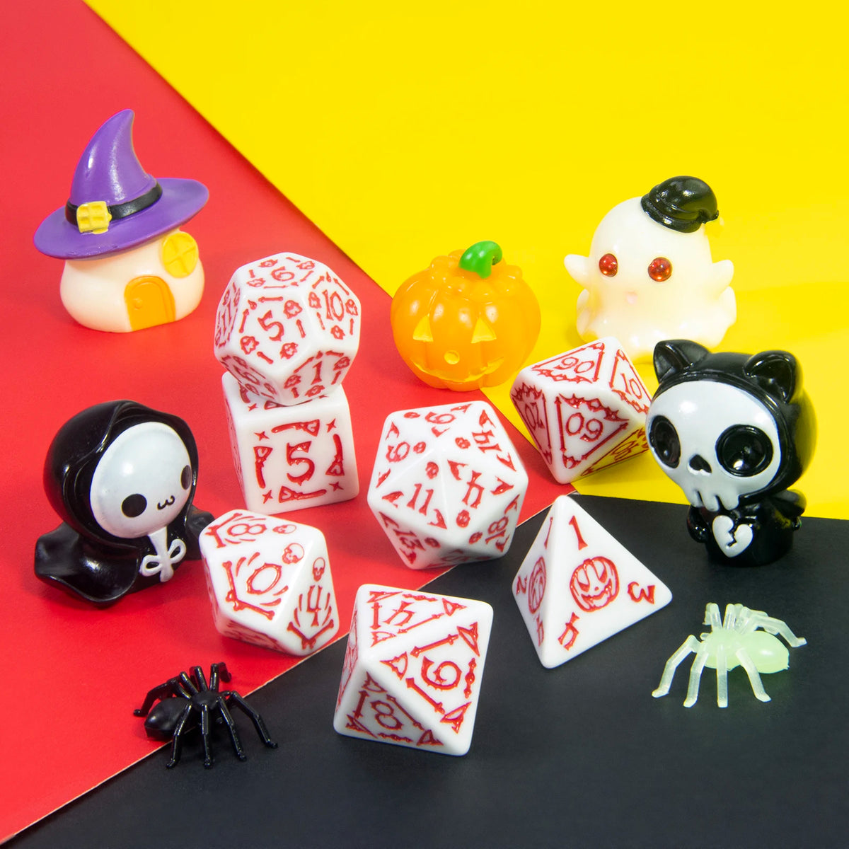 A set of seven polyhedral dice in various colors and shapes, including a witch hat and pumpkin, displayed on a red and yellow
