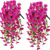 Two bunches of artificial pink morning glory flowers with green eucalyptus leaves used for hanging decor