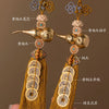 A pair of brass gourd and five emperor coins hanging ornaments made of golden yellow silk thread.