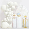 A white latex balloon garland arch kit featuring white and beige balloons displayed against a marble background.