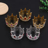 A set of four decorative crown toppers and hair accessories featuring gold, silver, and pink pearl accents.