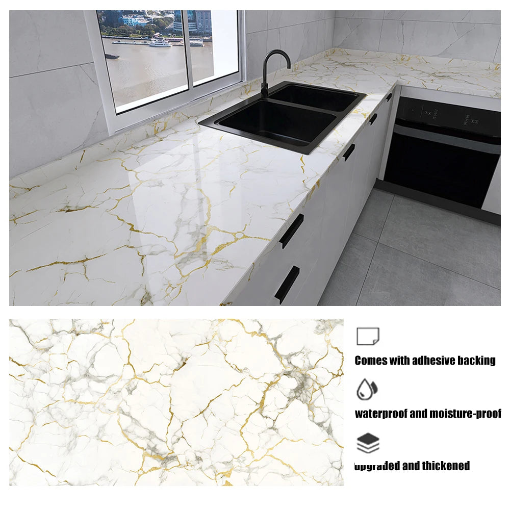 A white marble pattern self-adhesive backsplash panel installed on a kitchen countertop.