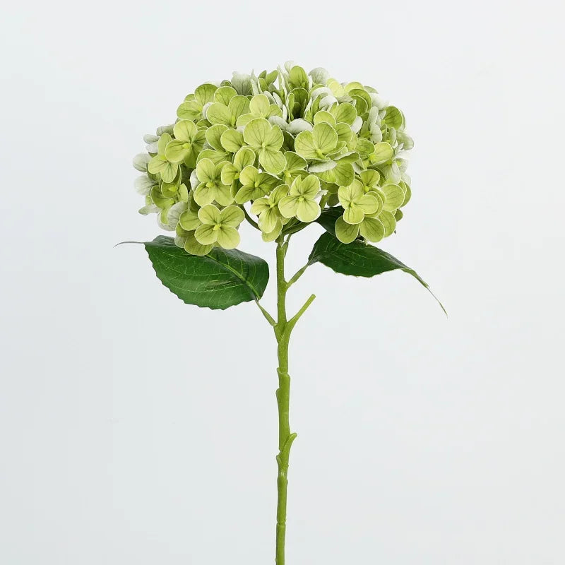 A sprig of artificial hydrangea flowers with green leaves on a stem.